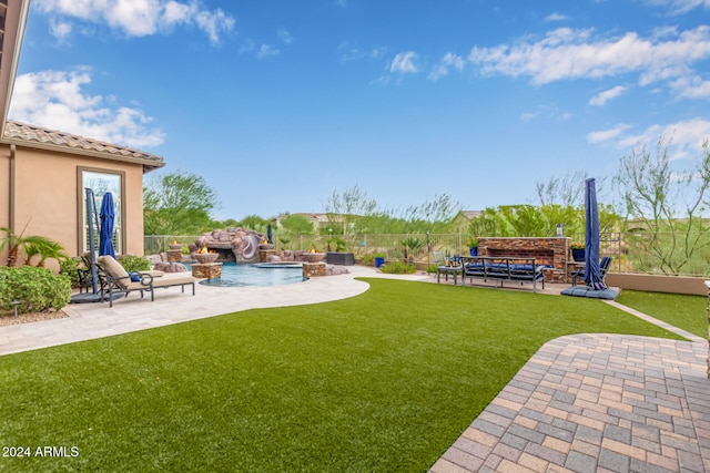 view of yard with a fenced in pool, a patio, an outdoor hangout area, and pool water feature