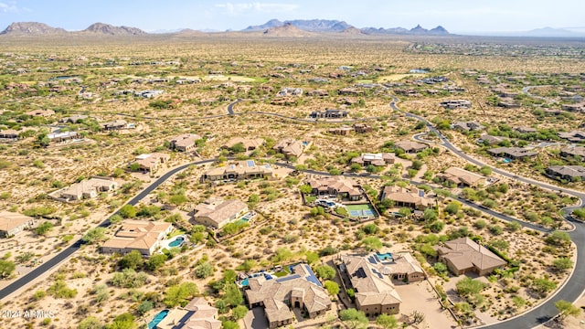 birds eye view of property with a mountain view