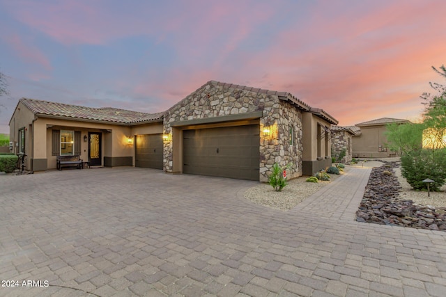 mediterranean / spanish house with a garage