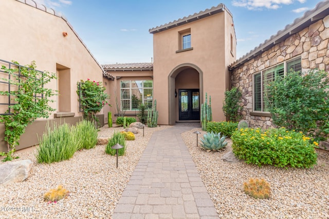 property entrance featuring french doors