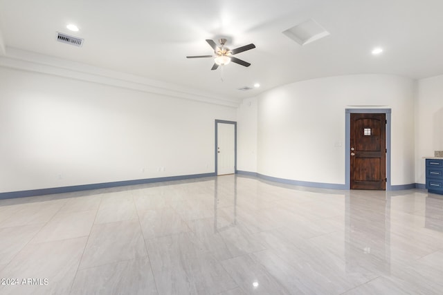 spare room with lofted ceiling and ceiling fan