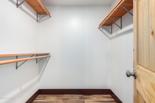 walk in closet featuring hardwood / wood-style flooring