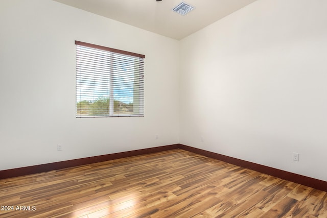 unfurnished room featuring hardwood / wood-style floors