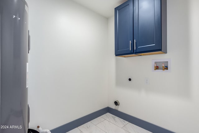 clothes washing area with electric dryer hookup, electric water heater, hookup for a washing machine, and cabinets