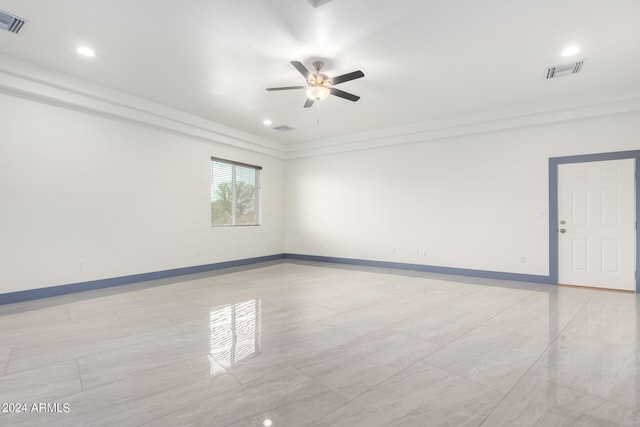 unfurnished room with ornamental molding and ceiling fan