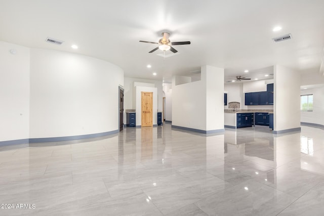 unfurnished room with ceiling fan