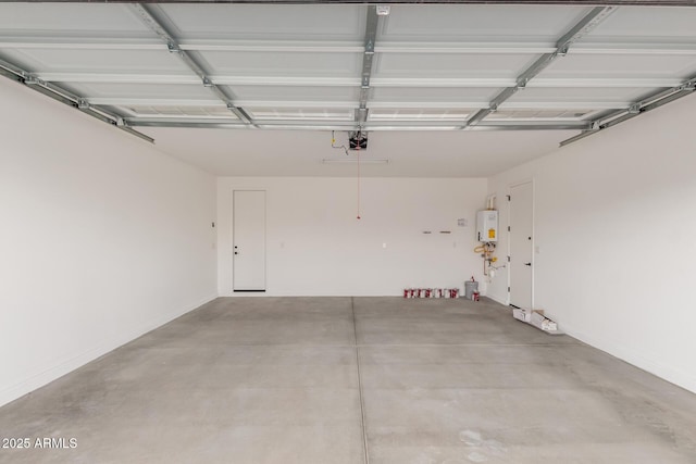 garage featuring a garage door opener and tankless water heater