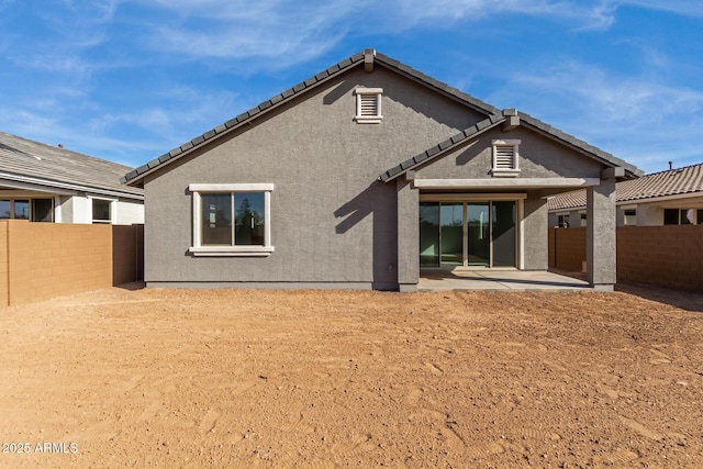 rear view of house featuring a patio