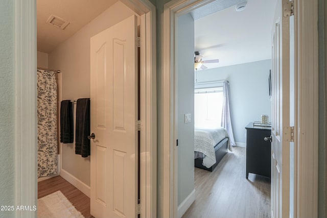 2218 E Anchor Dr, Gilbert, AZ 85234 - corridor featuring baseboards, visible vents, and light wood-type flooring