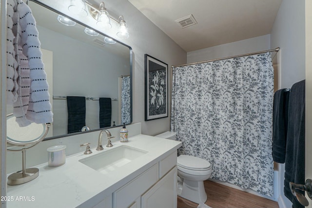 2218 E Anchor Dr, Gilbert, AZ 85234 - full bath with wood finished floors, visible vents, vanity, and toilet