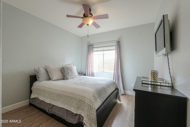 2218 E Anchor Dr, Gilbert, AZ 85234 - bedroom featuring baseboards, a ceiling fan, and light wood finished floors