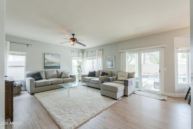 2218 E Anchor Dr, Gilbert, AZ 85234 - living room featuring a ceiling fan, wood finished floors, and a wealth of natural light
