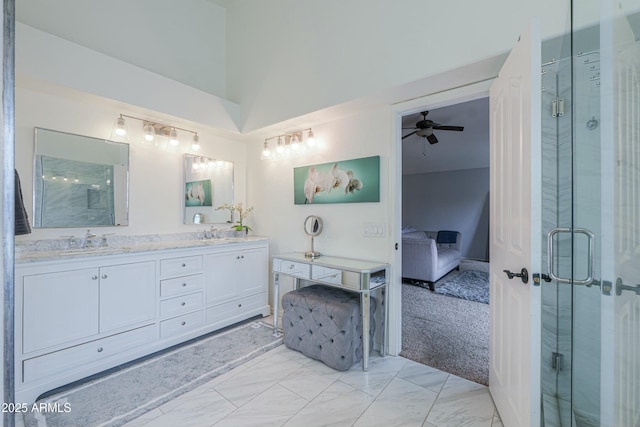 2218 E Anchor Dr, Gilbert, AZ 85234 - ensuite bathroom featuring a sink, marble finish floor, a shower stall, ceiling fan, and connected bathroom