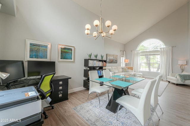 2218 E Anchor Dr, Gilbert, AZ 85234 - interior space with an inviting chandelier, baseboards, wood finished floors, and high vaulted ceiling