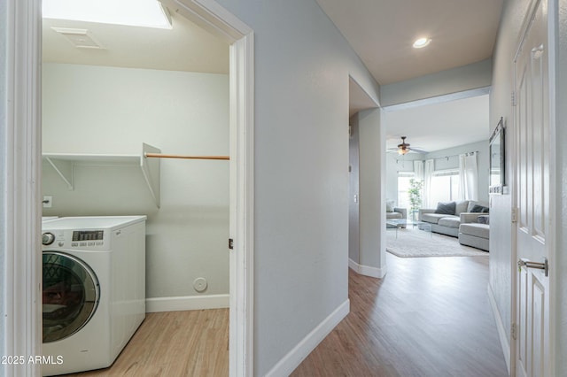 2218 E Anchor Dr, Gilbert, AZ 85234 - washroom with ceiling fan, washer / dryer, light wood-style flooring, baseboards, and laundry area