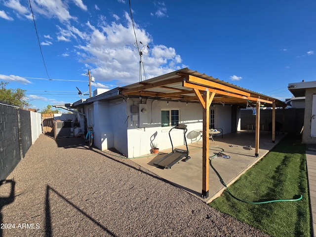 back of property with a patio