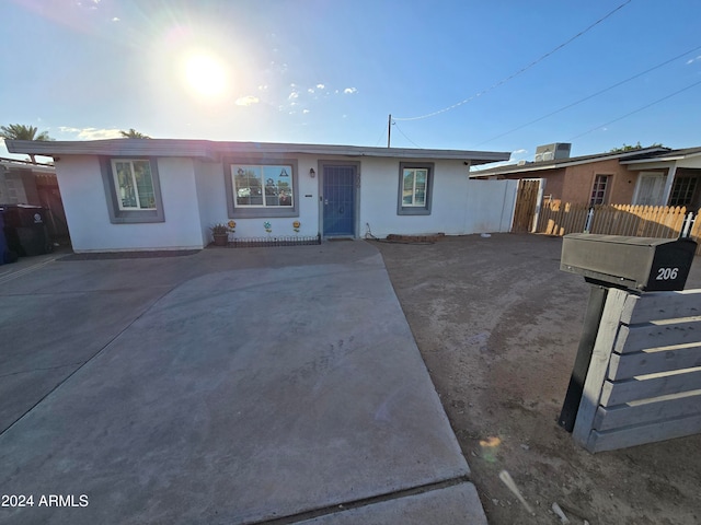 ranch-style house featuring a patio