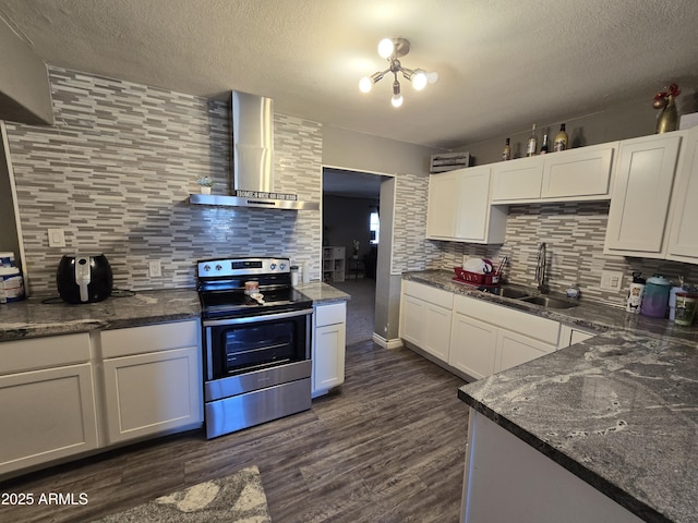 kitchen featuring white cabinetry, wall chimney exhaust hood, sink, stainless steel range with electric cooktop, and backsplash