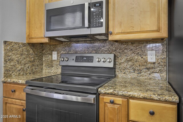 15235 S 30th St, Phoenix, AZ 85048 - kitchen with stainless steel appliances, backsplash, and brown cabinetry