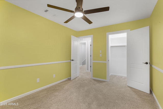 15235 S 30th St, Phoenix, AZ 85048 - unfurnished bedroom featuring carpet floors, a walk in closet, a ceiling fan, baseboards, and a closet