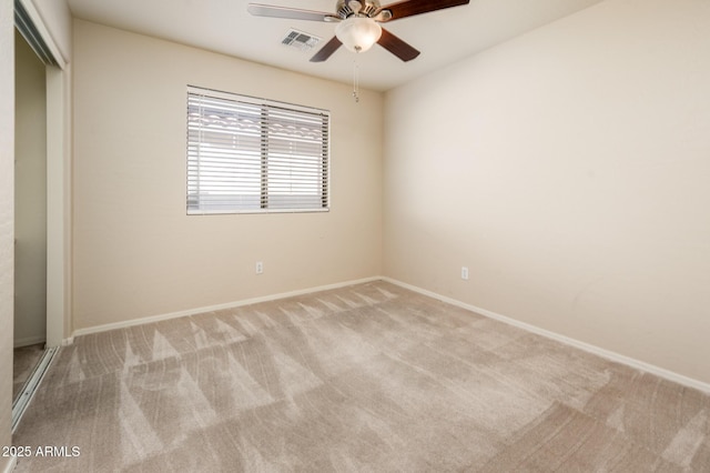 unfurnished bedroom with a closet, light carpet, and ceiling fan