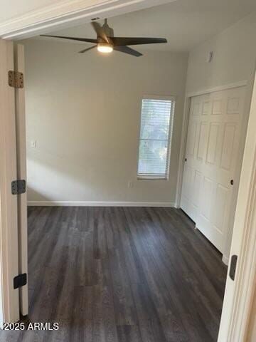 unfurnished bedroom with a closet, dark hardwood / wood-style floors, and ceiling fan