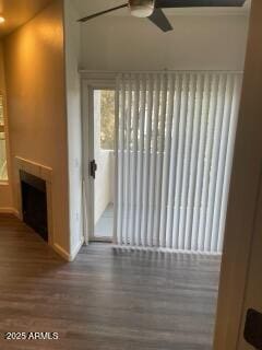 entryway with wood-type flooring and ceiling fan