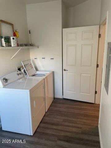 washroom featuring dark wood-type flooring and independent washer and dryer