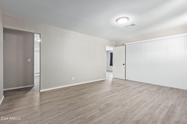 spare room with hardwood / wood-style flooring