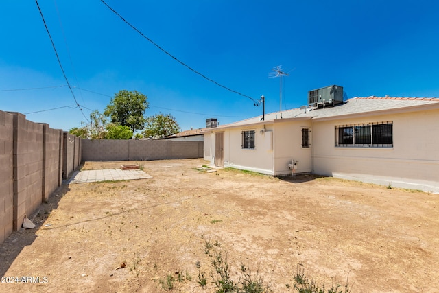 view of yard with a patio and central air condition unit