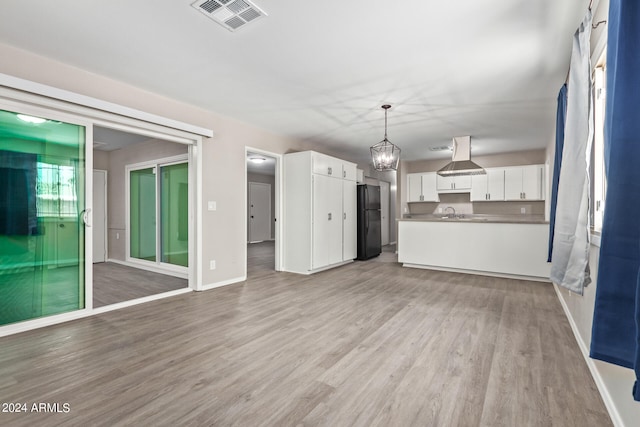 unfurnished living room featuring light hardwood / wood-style flooring