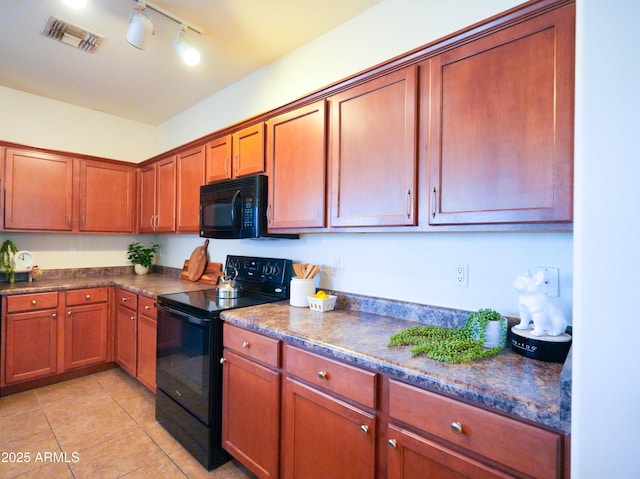 35721 N Zachary Rd, Queen Creek, AZ 85144 - kitchen featuring visible vents, brown cabinetry, light tile patterned flooring, and black appliances