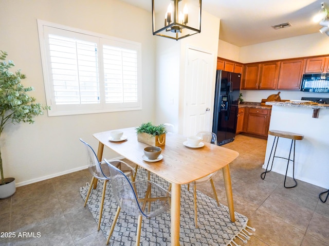 35721 N Zachary Rd, Queen Creek, AZ 85144 - dining space featuring visible vents, baseboards, light tile patterned floors, and a chandelier