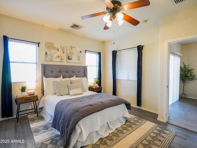 35721 N Zachary Rd, Queen Creek, AZ 85144 - bedroom with visible vents, a ceiling fan, baseboards, and wood finished floors