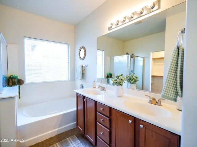 35721 N Zachary Rd, Queen Creek, AZ 85144 - bathroom with a garden tub, a sink, a stall shower, and tile patterned flooring