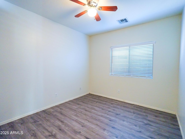 35721 N Zachary Rd, Queen Creek, AZ 85144 - empty room featuring visible vents, baseboards, ceiling fan, and wood finished floors