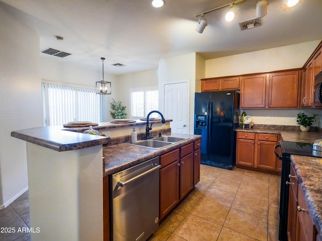 35721 N Zachary Rd, Queen Creek, AZ 85144 - kitchen with dark countertops, visible vents, a sink, and black appliances