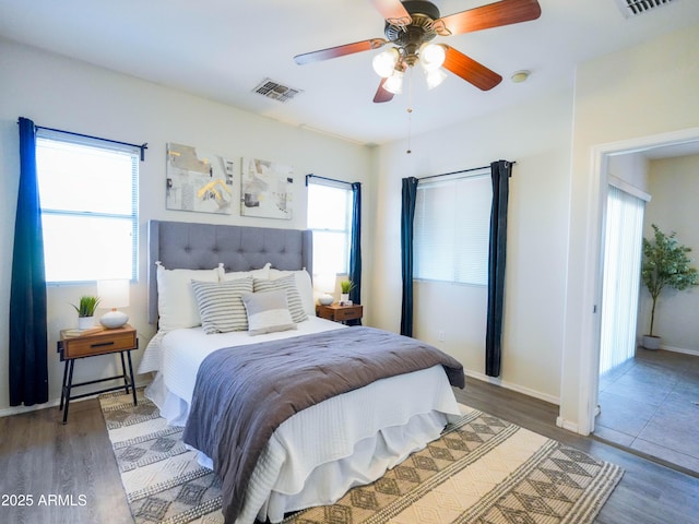 35721 N Zachary Rd, Queen Creek, AZ 85144 - bedroom featuring a ceiling fan, baseboards, visible vents, and wood finished floors