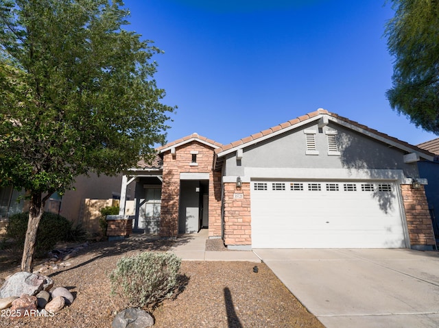 35721 N Zachary Rd, Queen Creek, AZ 85144 - single story home featuring a tile roof, concrete driveway, an attached garage, stone siding, and stucco siding