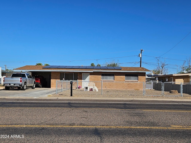 view of front of home featuring solar panels