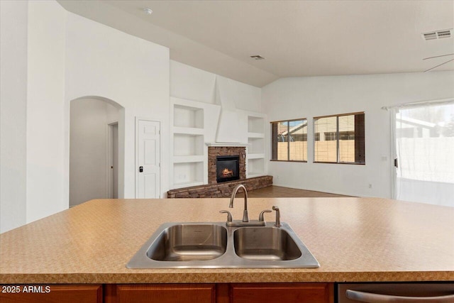 kitchen featuring plenty of natural light, light countertops, visible vents, and a sink