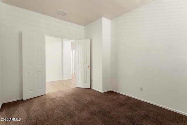 empty room with light carpet, baseboards, and visible vents