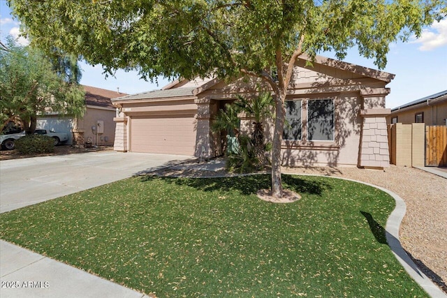 single story home featuring a garage, concrete driveway, a front yard, and stucco siding