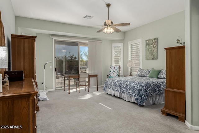 carpeted bedroom with ceiling fan and access to exterior