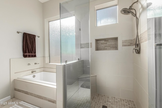 bathroom with independent shower and bath and tile patterned flooring