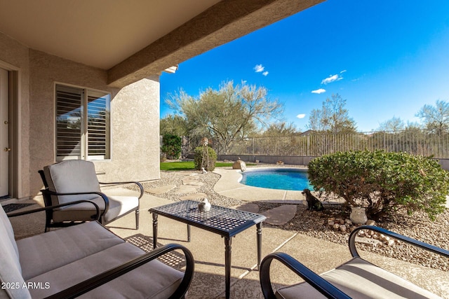 view of patio featuring a fenced in pool