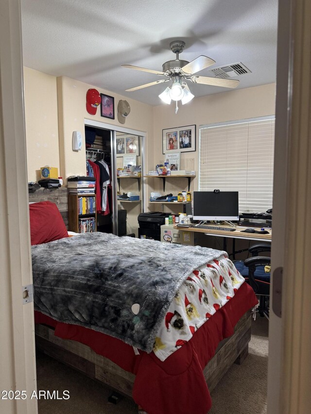 1448 E Mobile Ln, Phoenix, AZ 85040 - bedroom featuring an office area, a closet, a ceiling fan, and carpet floors