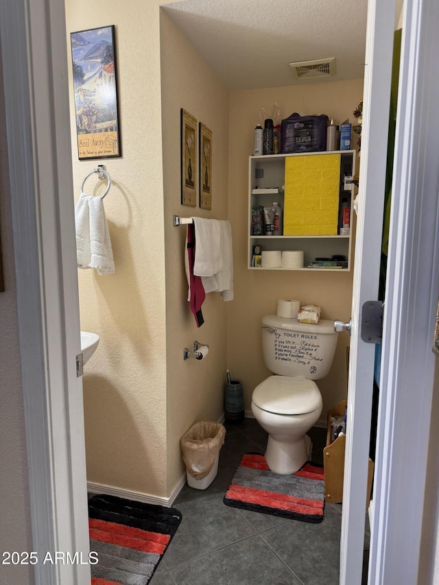 1448 E Mobile Ln, Phoenix, AZ 85040 - half bath with toilet, tile patterned floors, and baseboards