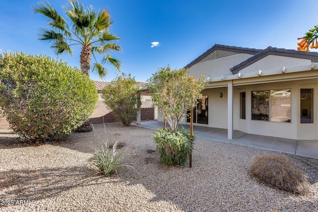 rear view of property featuring a patio