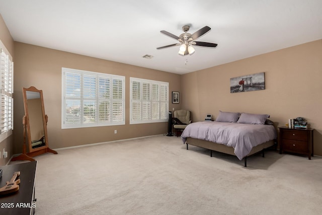 1268 N Pine St, Gilbert, AZ 85233 - carpeted bedroom featuring multiple windows and ceiling fan